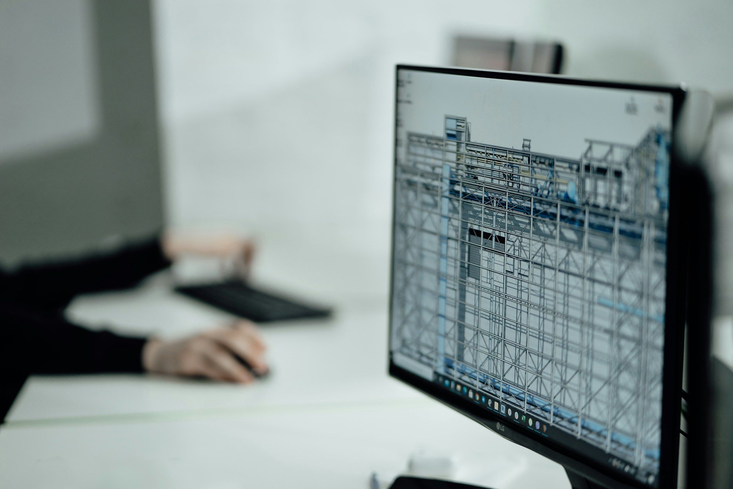 Engineer reviewing a 3D model on a monitor